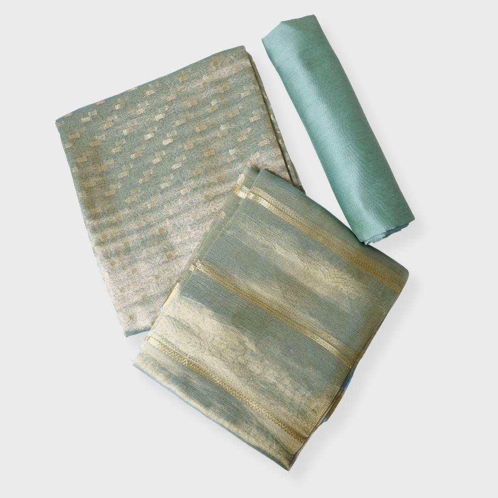 Pista Green Three Peice Unstiched Tissue Buti Suit With Zari Striped Tissue Dupatta. Sku 117522